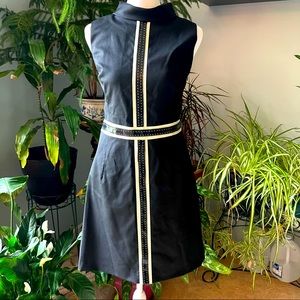 Mini cocktail dress by  Milly NY has collar and faux leather trim on ivory trim